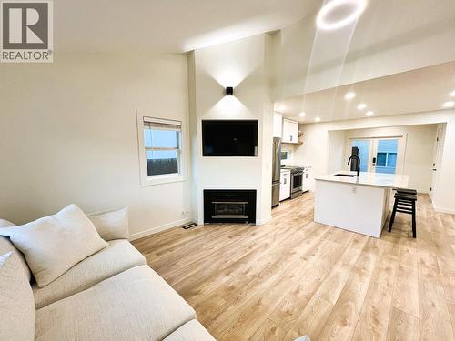 Living Room - Main House - 2174 Richter Avenue, Kelowna, BC - Indoor Photo Showing Living Room With Fireplace