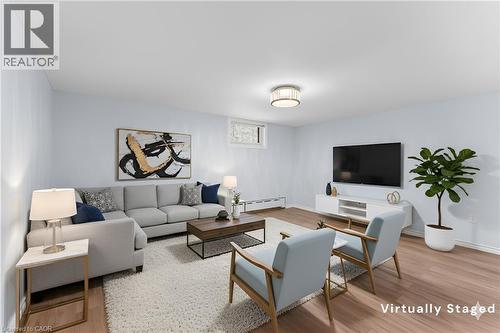 Virtually Staged - 19 Moote Street, St. Catharines, ON - Indoor Photo Showing Living Room
