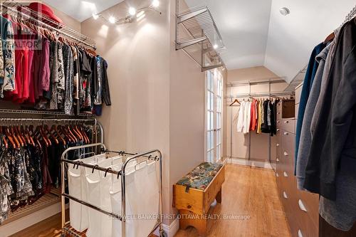 Primary bedroom has two walk-in closets - 320 Pike Lake Route 12 Road, Tay Valley, ON - Indoor With Storage