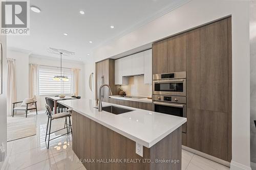 Breakfast bar for family gatherings. - 129 High Street W, Mississauga, ON - Indoor Photo Showing Kitchen With Upgraded Kitchen