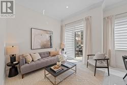 Sunny family room, perfect for gatherings. - 