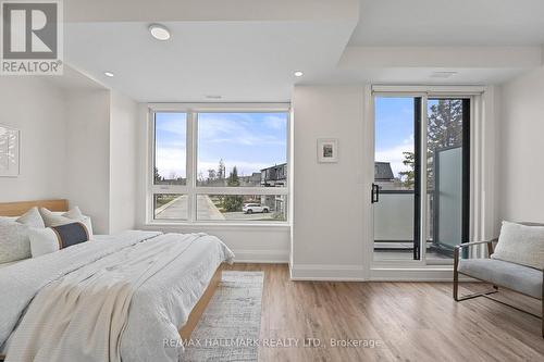 Third bedroom features a private balcony. - 129 High Street W, Mississauga, ON - Indoor Photo Showing Bedroom