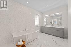 Porcelain floors and herringbone-tile walls. - 