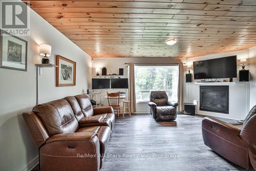 Home main floor - 410 Etwell Road, Huntsville (Stisted), ON - Indoor Photo Showing Living Room With Fireplace