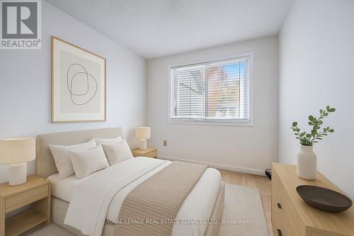 Virtually Staged Second Bedroom - 7 - 1241 Mccraney Street E, Oakville, ON - Indoor Photo Showing Bedroom