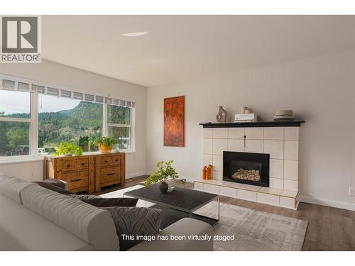 3725 Dogwood Drive, Trail, BC - Indoor Photo Showing Living Room With Fireplace