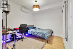 Spacious bedroom with closet & a sliding glass door for privacy - 