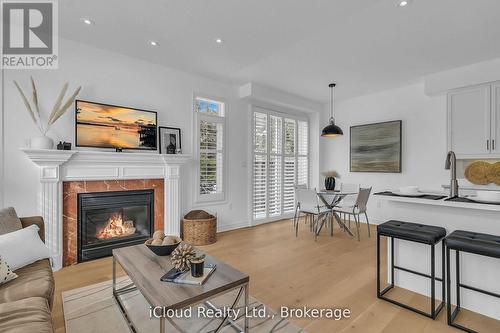 18 - 2295 Rochester Circle, Oakville, ON - Indoor Photo Showing Living Room With Fireplace