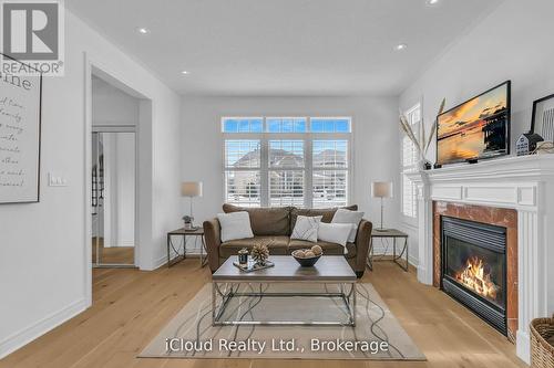 18 - 2295 Rochester Circle, Oakville, ON - Indoor Photo Showing Living Room With Fireplace