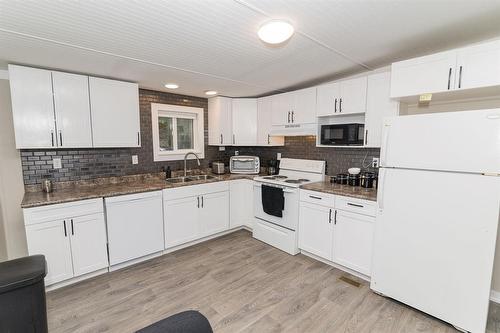 8 Mobile Street, Carman, MB - Indoor Photo Showing Kitchen With Double Sink
