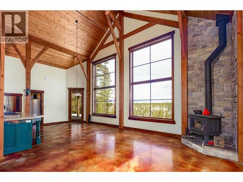 Original Photo - 2600 Wycliffe Park Road, Cranbrook, BC - Indoor Photo Showing Other Room With Fireplace