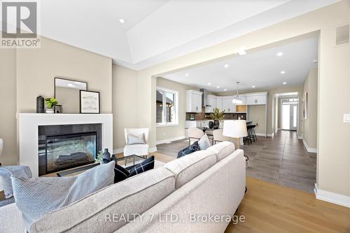 566 Old Course Trail, Welland, ON - Indoor Photo Showing Living Room With Fireplace