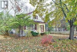 Level lot; numerous shade trees in the front yard. - 