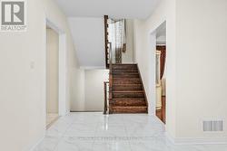 Hardwood Staircase Leading to the Upper Level - 