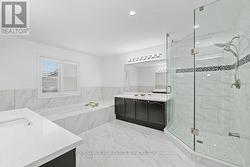 Spa-Inspired Primary Ensuite with Double Vanities - 