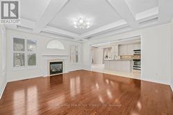 Family Room with Gas Fireplace & Coffered Ceiling - 