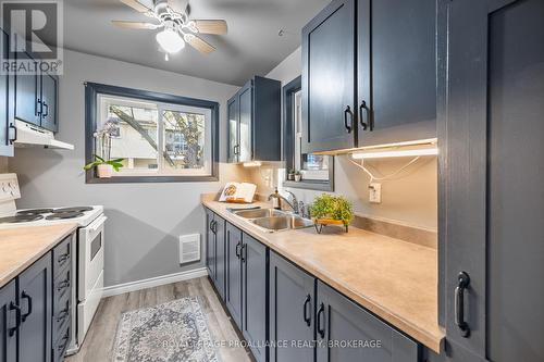 203 - 845 Milford Drive, Kingston (North Of Taylor-Kidd Blvd), ON - Indoor Photo Showing Kitchen With Double Sink