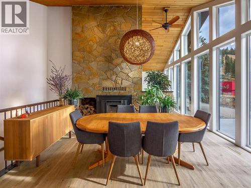 21815 Garnet Valley Road, Summerland, BC - Indoor Photo Showing Dining Room With Fireplace