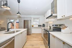 CUSTOM KITCHEN W/QUARTZ COUNTERTOPS - 