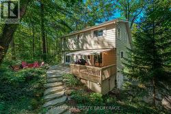 Amour stone stairs to custom hardscaped firepit - 