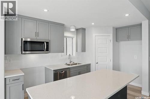 214 Antonini Court, Saskatoon, SK - Indoor Photo Showing Kitchen With Double Sink