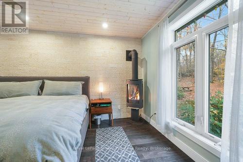 propane fireplace - 34 Beechwood Lane, Seguin, ON - Indoor Photo Showing Bedroom