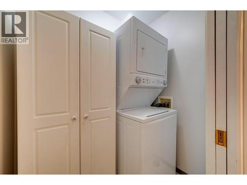 newer stacker washer / dryer - 860 Nicolani Drive Unit# 204, Kamloops, BC - Indoor Photo Showing Laundry Room