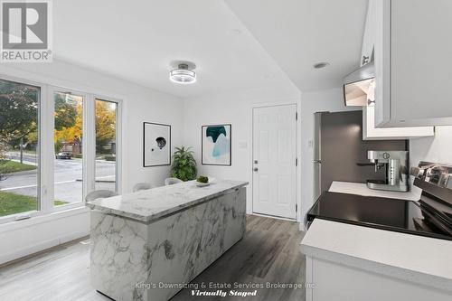 Kitchen Virtually Staged with Island - 142 Lynbrook Drive, Hamilton, ON - Indoor