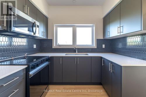 60 - 940 St.David Street N, Centre Wellington (Fergus), ON - Indoor Photo Showing Kitchen With Double Sink