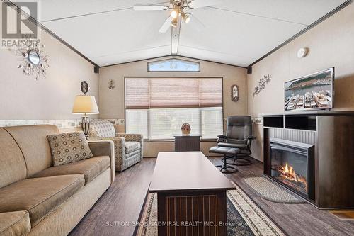 70 - 1082 Shamrock Marina Road, Gravenhurst, ON - Indoor Photo Showing Living Room With Fireplace