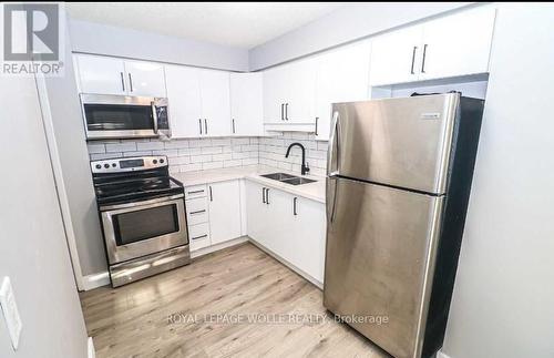 L81 - 223 Pioneer Drive, Kitchener, ON - Indoor Photo Showing Kitchen With Double Sink With Upgraded Kitchen