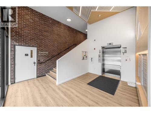 Fob needed to use the elevator, and elevator monitored 24/7 - 660 Cawston Avenue Unit# 313, Kelowna, BC - Indoor Photo Showing Other Room