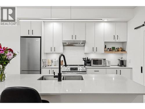 All appliances are stainless steel Frigidaire (2022) - 660 Cawston Avenue Unit# 313, Kelowna, BC - Indoor Photo Showing Kitchen With Upgraded Kitchen