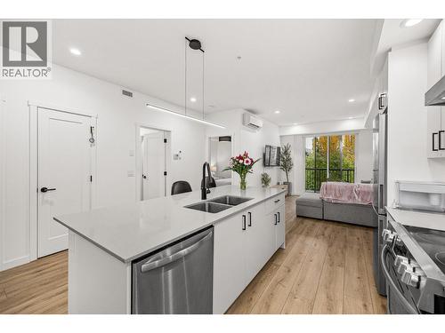 Large island with space for up to four stools - 660 Cawston Avenue Unit# 313, Kelowna, BC - Indoor Photo Showing Kitchen With Double Sink With Upgraded Kitchen