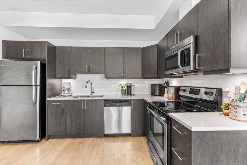 201-317 Burnside Rd East, Victoria, BC - Indoor Photo Showing Kitchen With Upgraded Kitchen