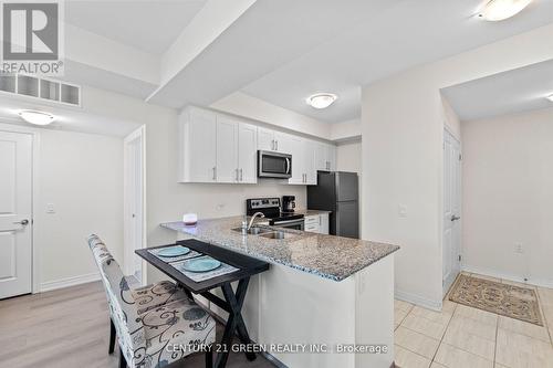 306 - 2370 Khalsa Gate, Oakville, ON - Indoor Photo Showing Kitchen With Double Sink