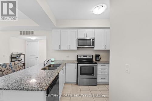306 - 2370 Khalsa Gate, Oakville, ON - Indoor Photo Showing Kitchen With Stainless Steel Kitchen With Double Sink With Upgraded Kitchen