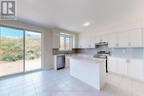 87 Lawrence D. Pridham Avenue, New Tecumseth, ON - Indoor Photo Showing Kitchen With Double Sink