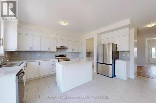87 Lawrence D. Pridham Avenue, New Tecumseth, ON - Indoor Photo Showing Kitchen With Double Sink