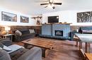 A-1971 Fairway Road, Revelstoke, BC  - Indoor Photo Showing Living Room With Fireplace 