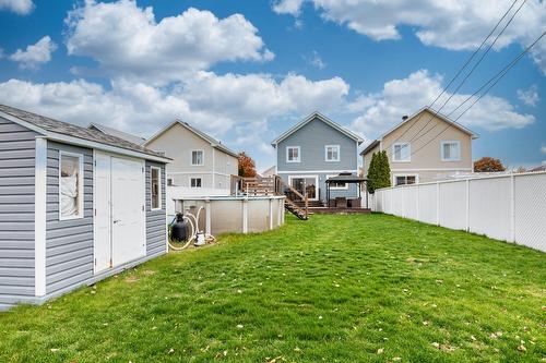 Backyard - 87 Rue Charles-Yelle, La Prairie, QC - Outdoor With Above Ground Pool