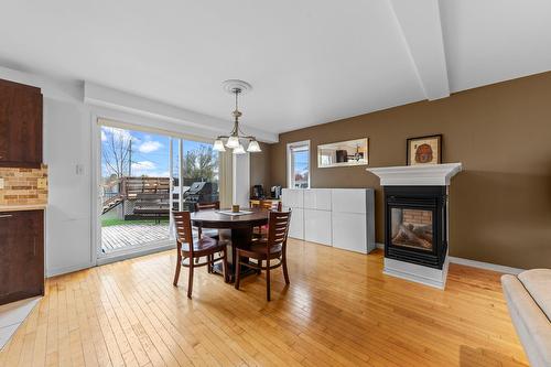Dining room - 87 Rue Charles-Yelle, La Prairie, QC - Indoor Photo Showing Dining Room With Fireplace