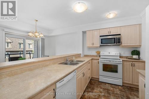 205 - 26 Dairy Lane, Huntsville (Chaffey), ON - Indoor Photo Showing Kitchen With Double Sink