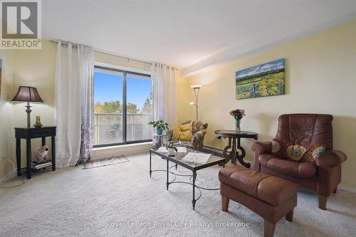 Sliding doors to Balcony - 403 - 93 Westwood Road, Guelph (Willow West/Sugarbush/West Acres), ON - Indoor Photo Showing Living Room