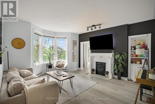 408 - 460 Wellington Street, London East (East F), ON - Indoor Photo Showing Living Room With Fireplace