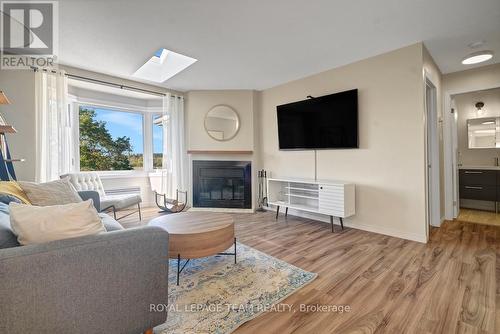 2 - 2 Stonebank Crescent, Ottawa, ON - Indoor Photo Showing Living Room With Fireplace