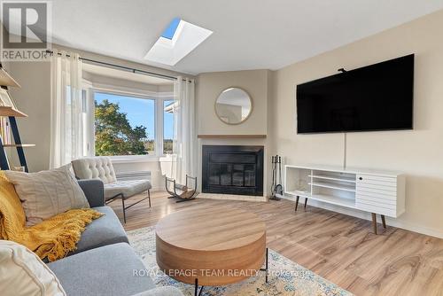 2 - 2 Stonebank Crescent, Ottawa, ON - Indoor Photo Showing Living Room With Fireplace