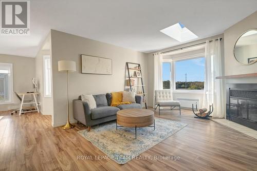 2 - 2 Stonebank Crescent, Ottawa, ON - Indoor Photo Showing Living Room With Fireplace