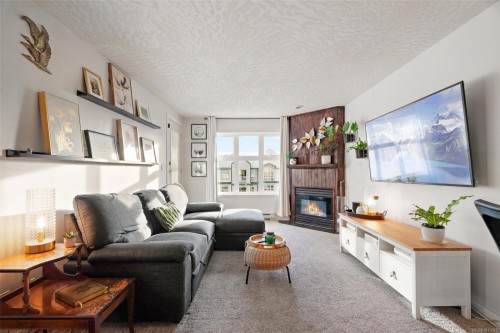 311-3010 Washington Ave, Victoria, BC - Indoor Photo Showing Living Room With Fireplace