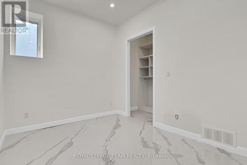 Basement bed w/ walk-in closet - 826 Alpine Avenue, Ottawa, ON - Indoor Photo Showing Other Room